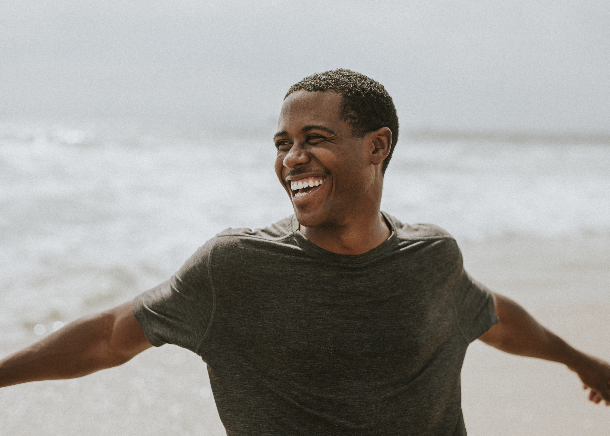 Cheerful man enjoying on the beach